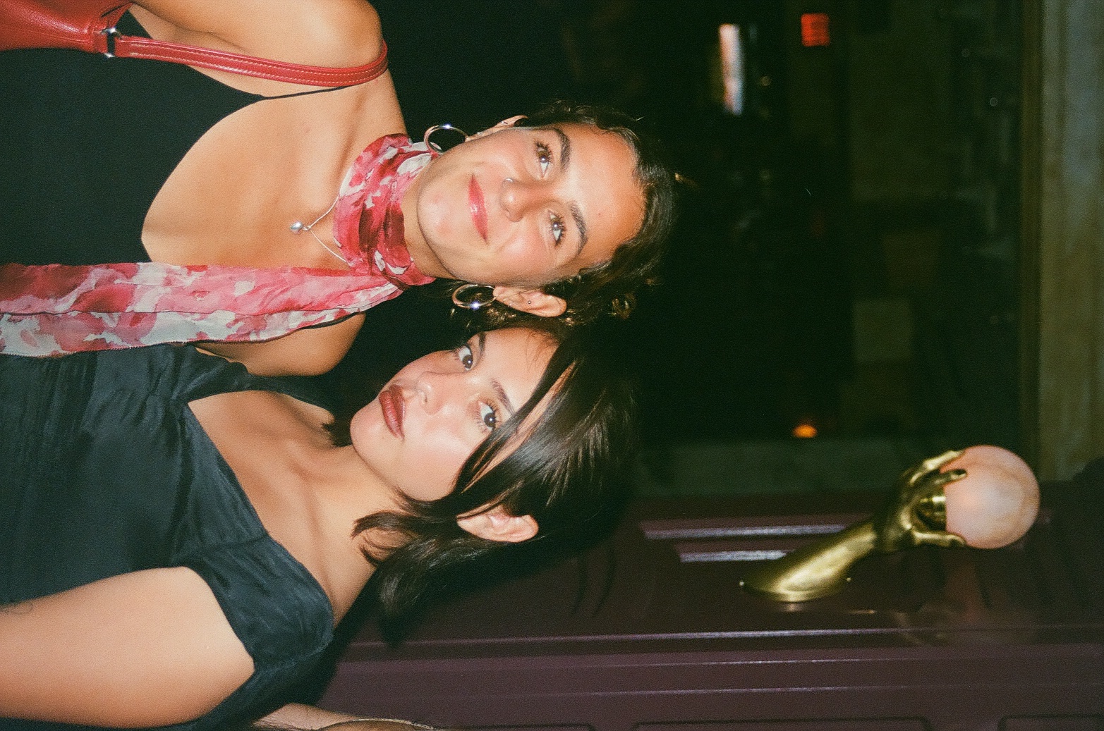 Kayden and Val on a night out under a golden lamp