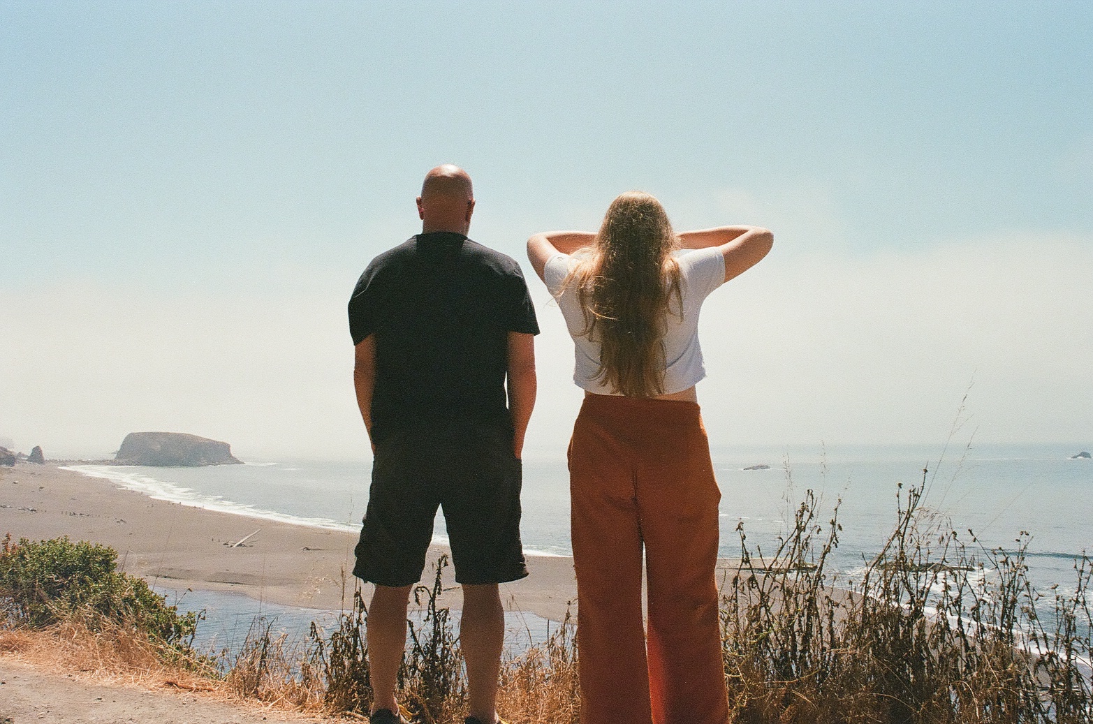Two people looking out over the Northern California coast