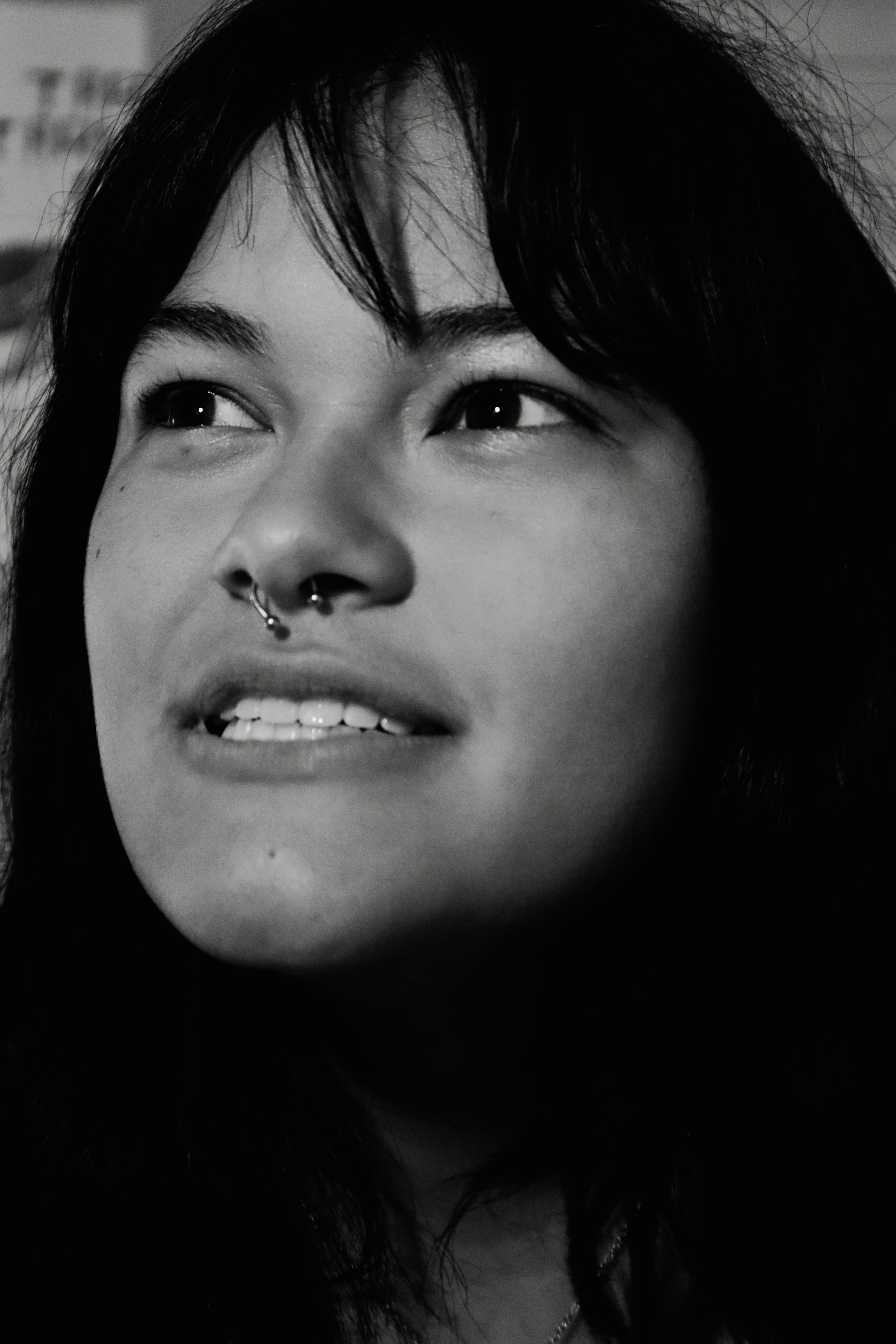 Woman looking up with soft expression, black and white