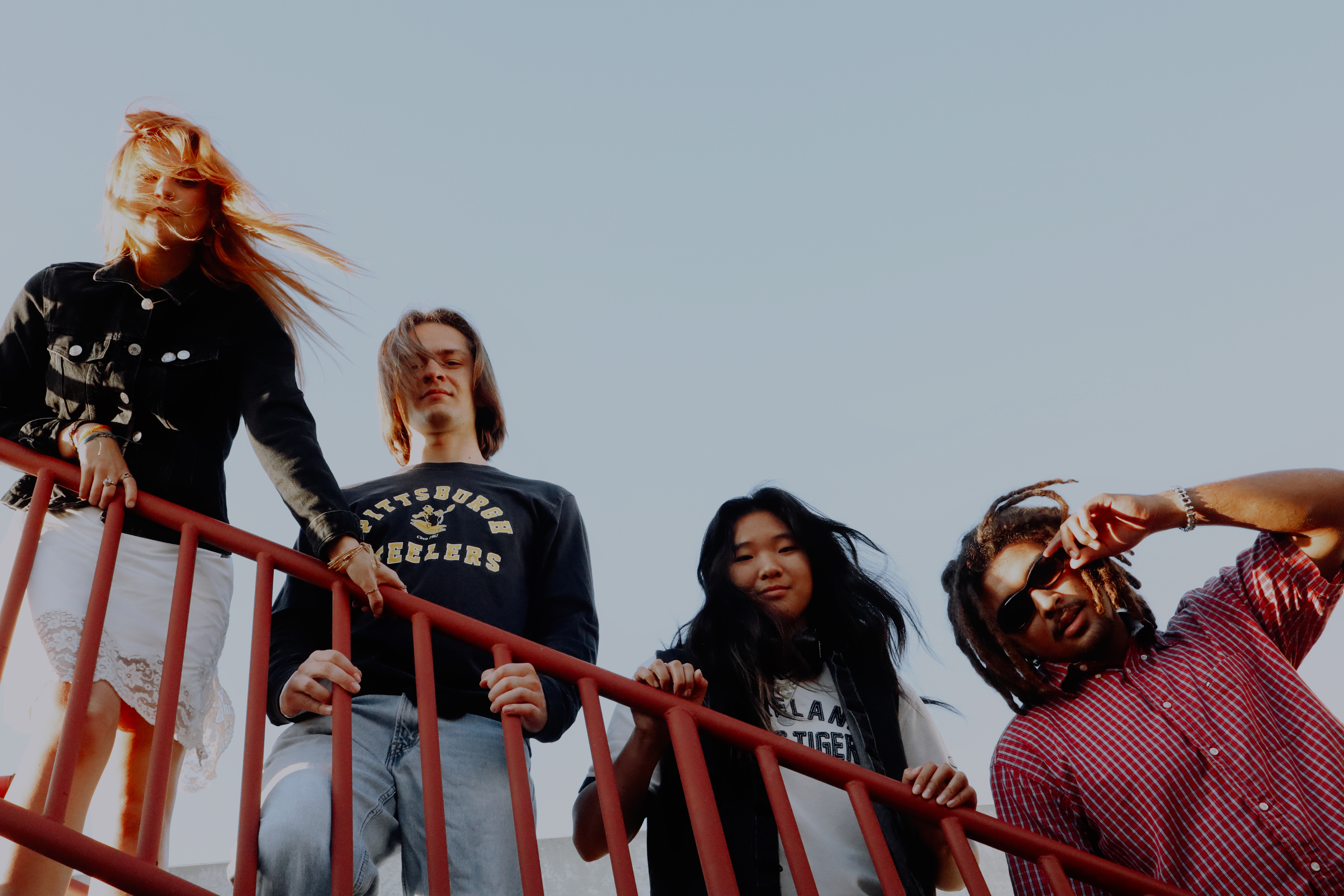 Misfire band on red railings with wind blown hair