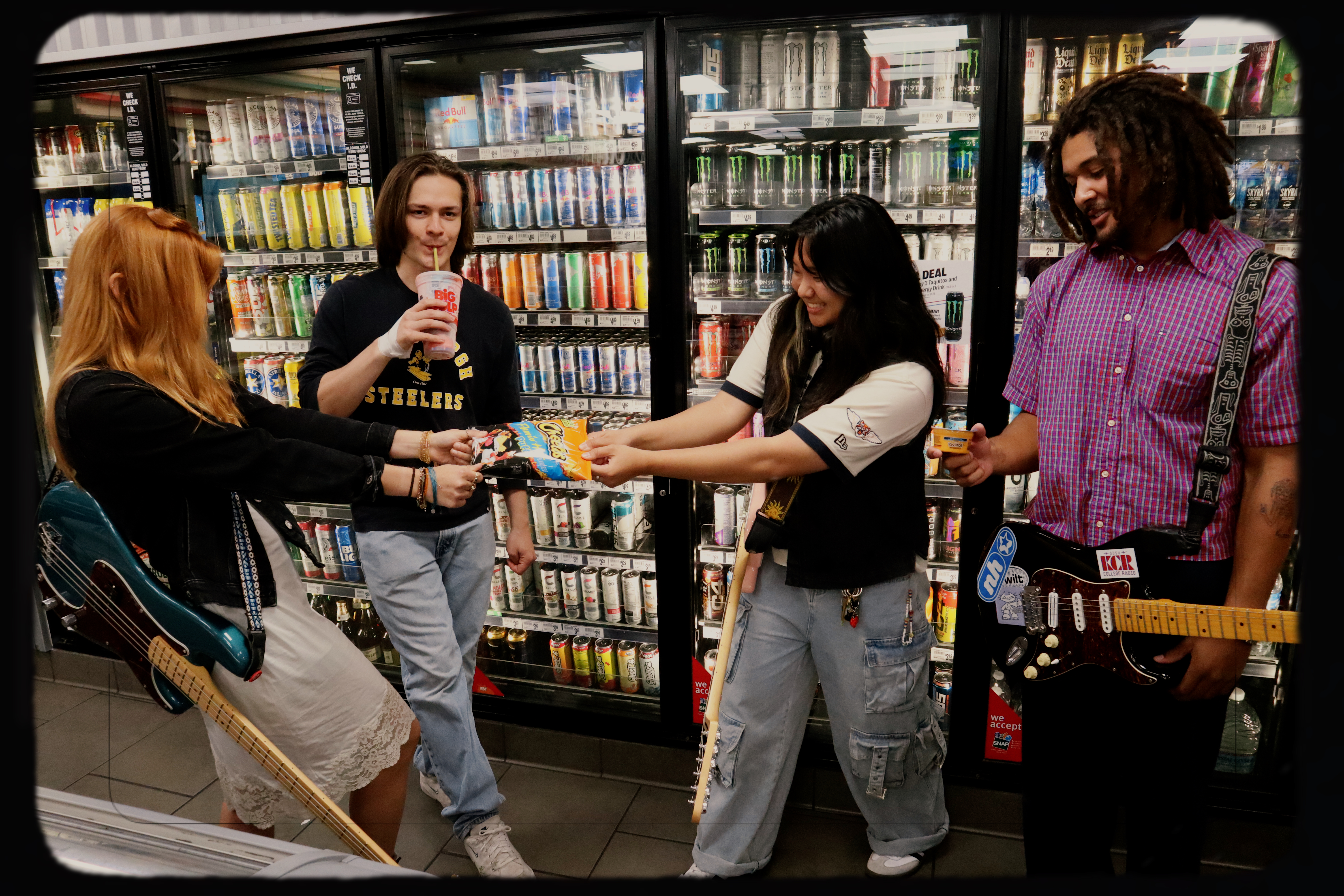 Misfire band in a convenience store with guitars